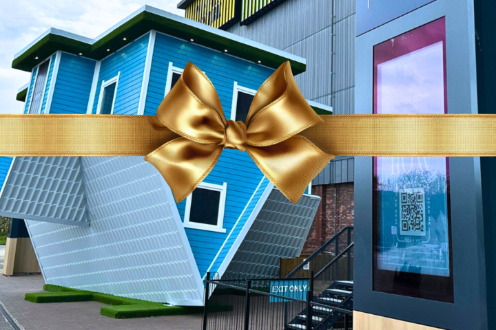 Upside-down blue house with a golden ribbon across the image.