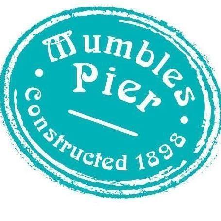 Turquoise circular logo with 'Mumbles Pier Constructed 1898' text.