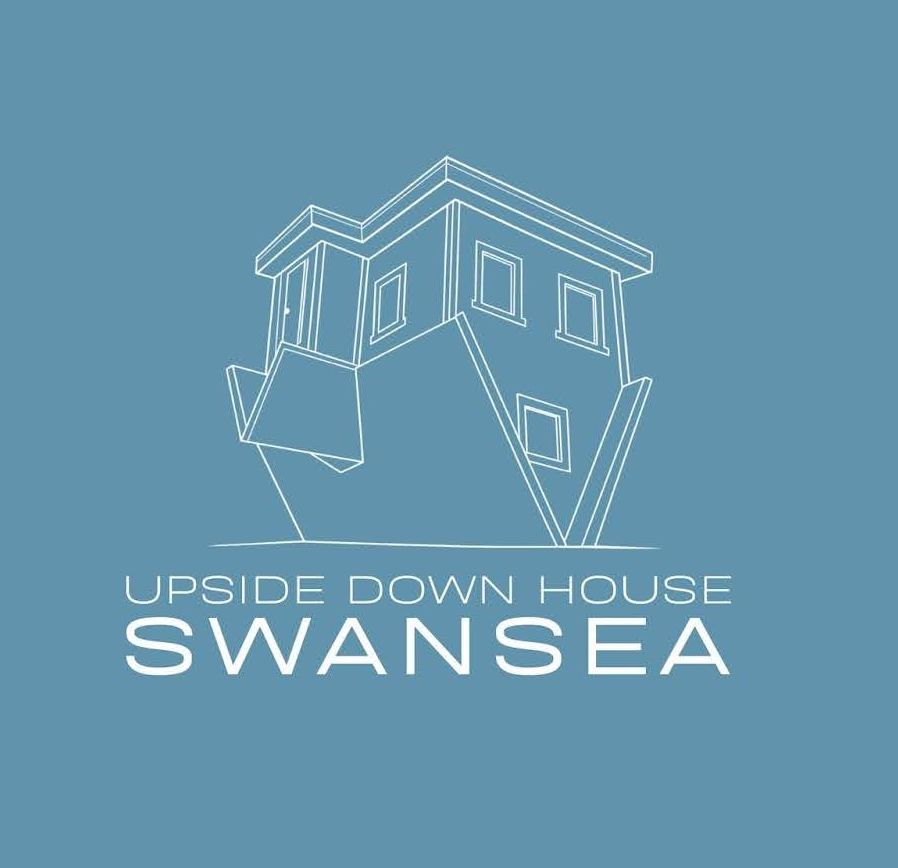 Line drawing of an upside-down house with text 'Upside Down House Swansea' on blue background.