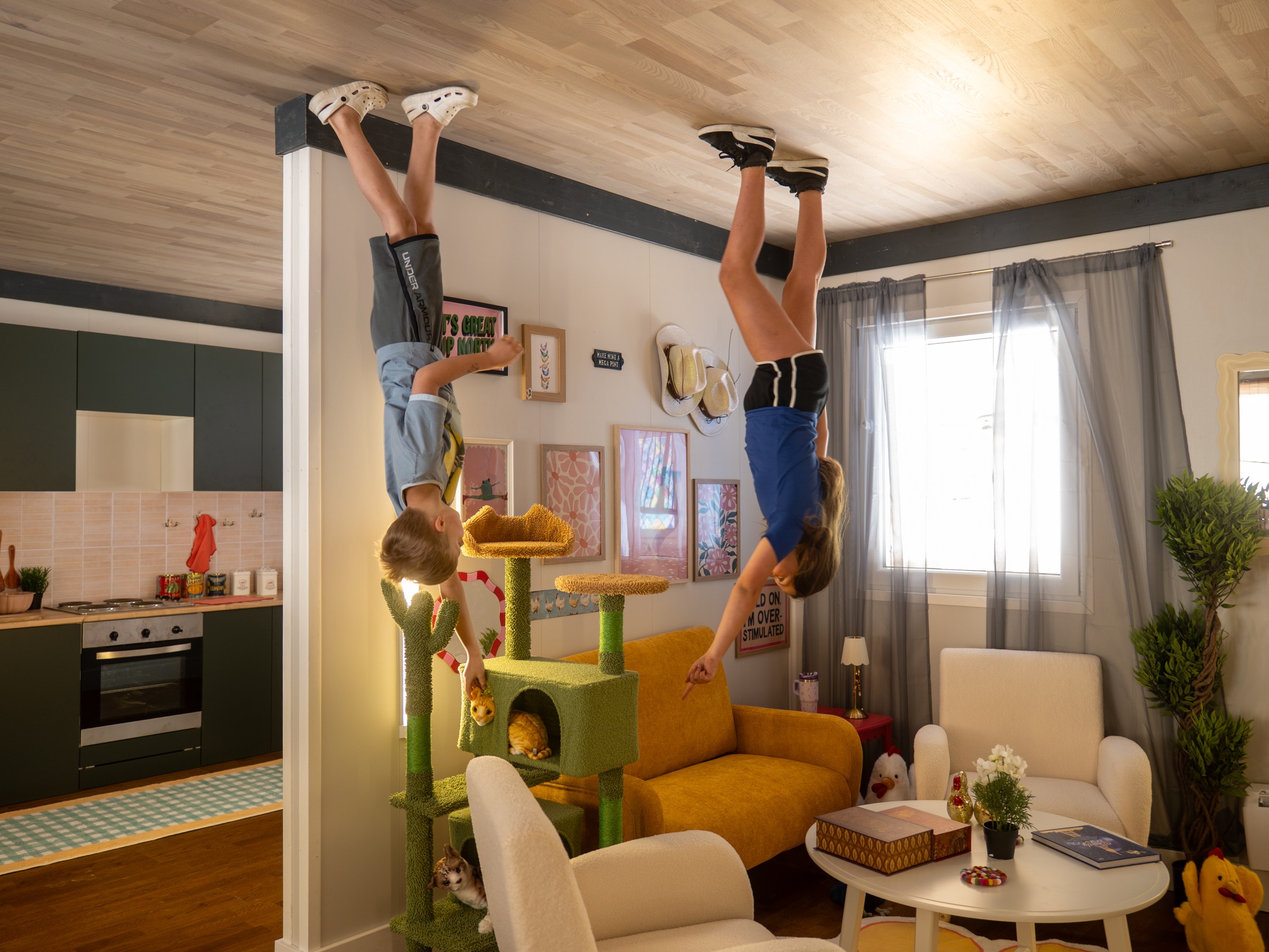Two people appear to be standing on the ceiling of a room.